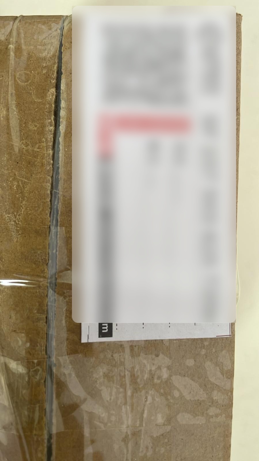 Shipment proof with label details masked for privacy